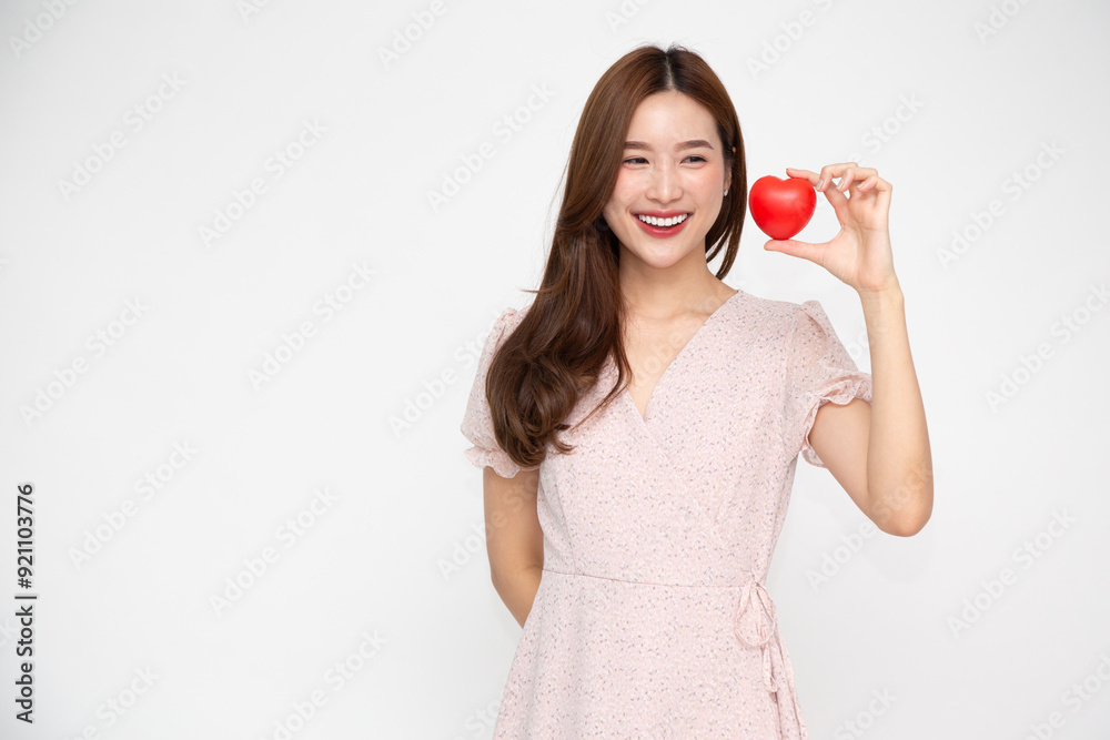 Young Asian woman showing red love heart sign isolated on white background Young Asian woman showing red love heart sign isolated on white background