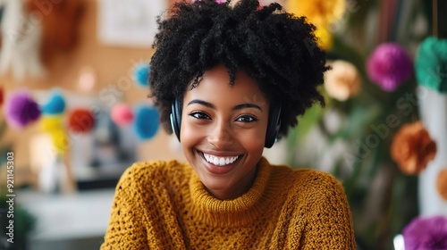 Joyful Beats: Young woman with headphones smiles radiantly, embracing the power of music and positive vibes in her colorful creative space. 