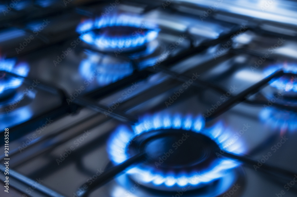 Blurred image of gas burners on a kitchen gas stove