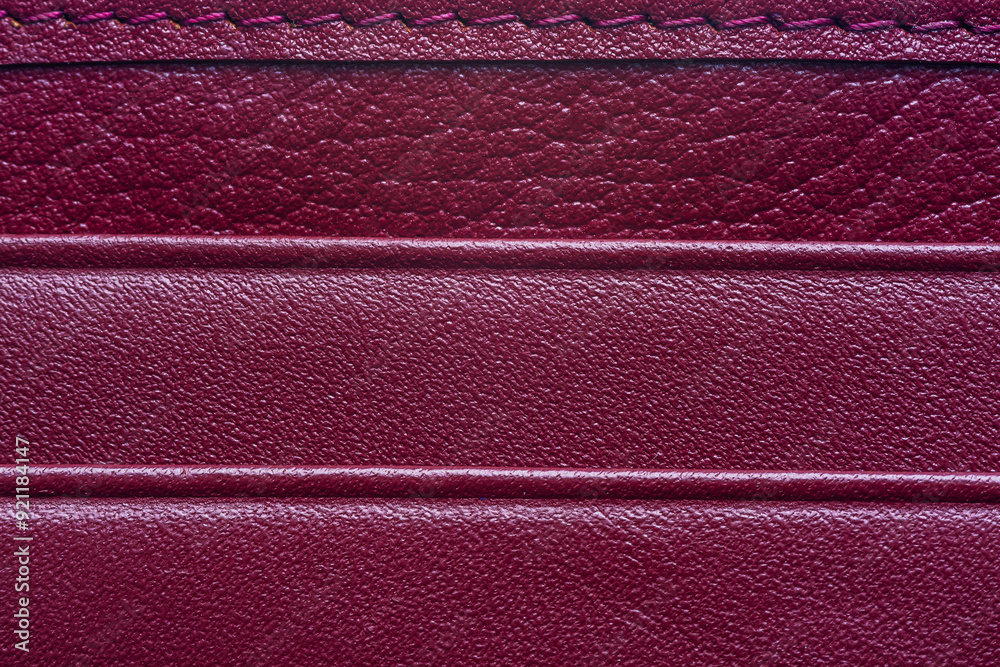 Fototapeta premium Red macro leather texture,Texture of artificial leather scarlet color,Leather samples with stitches