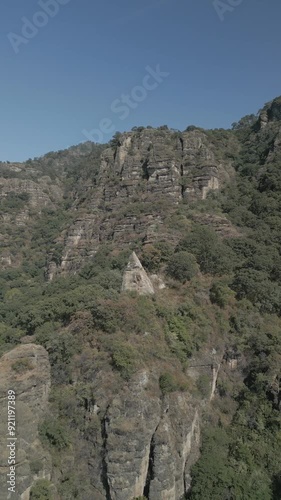 Vertical drone video. Rock formations, forested mountains and large formations. Hiking through the green forest. Hiking concept. Amatlan, Mexico
 photo