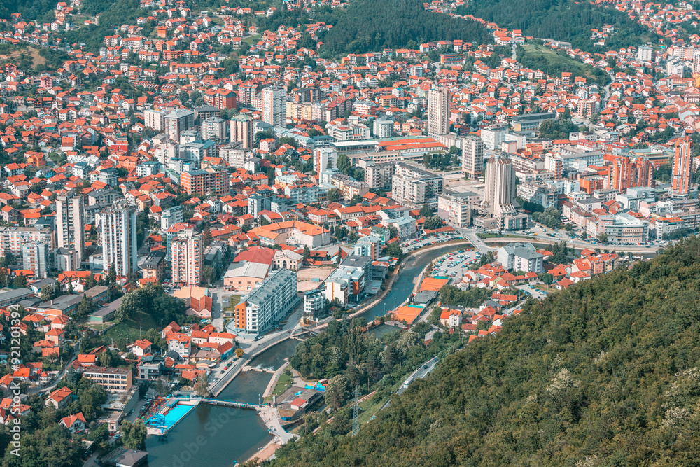 Fototapeta premium Beautiful city view of Uzice city, Serbia from above, highlighting the European architecture and the vibrant landscape