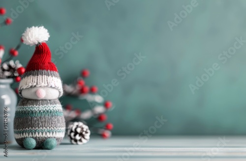 Festive Knit Snowman Ornament on Soft Green Background With Bokeh Lights