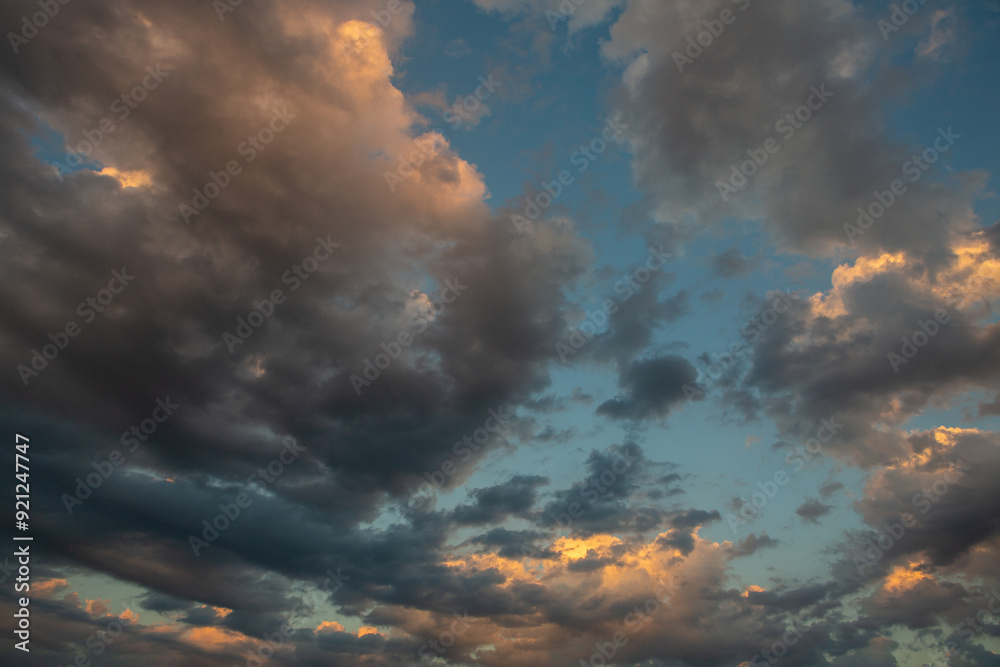 Cloudscape, Colored Clouds at Sunset near the Ocean in a Cloudy Day