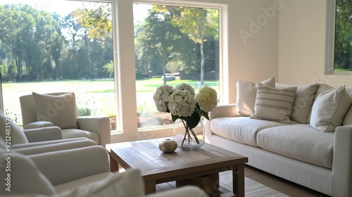 Cozy Living Room With Bright Natural Light and Elegant White Sofas