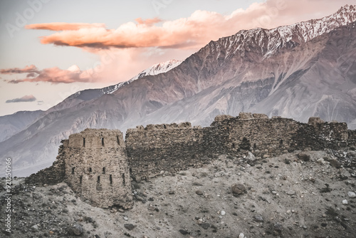 Remains of the ancient fortress Yamchun in the Tien Shan mountains in Tajikistan in Pamir, ruins of the fortress fort in the evening at sunset photo