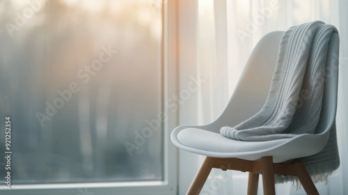 Modern White Chair in Bright Room With Urban View on a Sunny Day