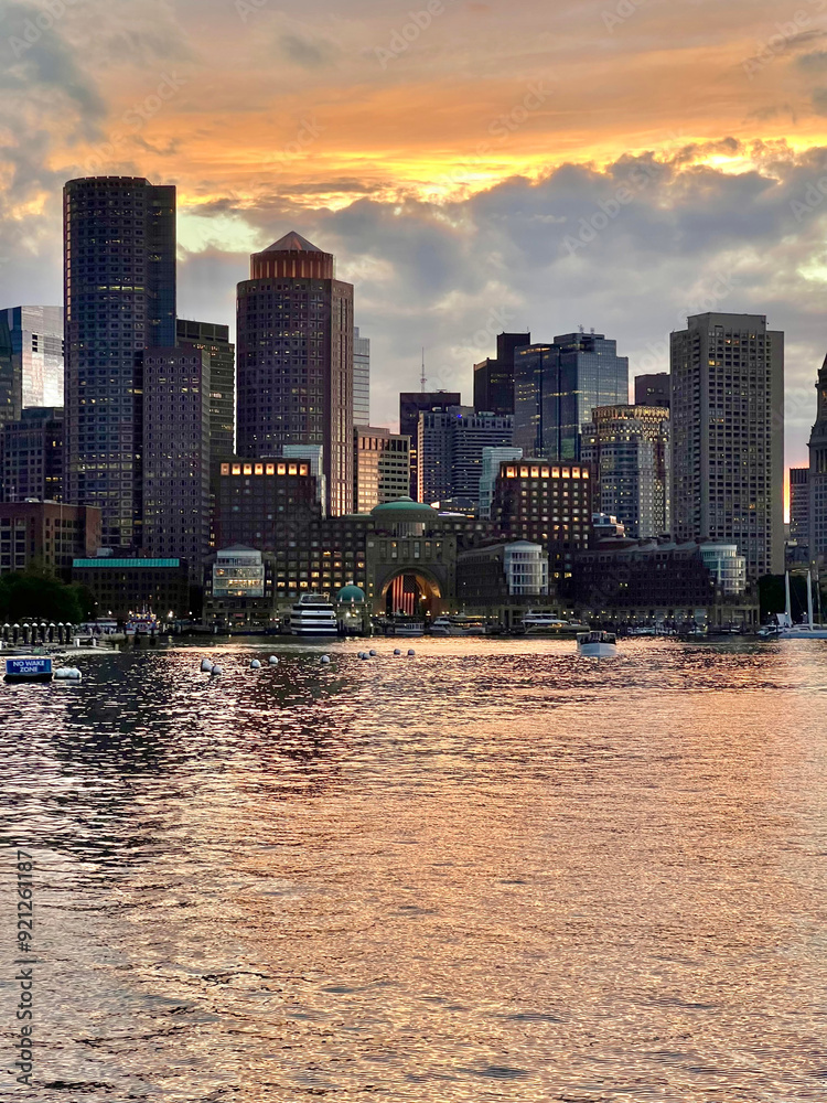 Fototapeta premium Sunset city skyline from the sea - Boston, MA