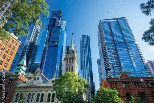 Group of Tall Buildings in Melbourne, Illustrate the contrast between the historic architecture of the Loop and the modern skyscrapers of the Gold Coast