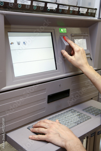 pharmacist selects medicine from hospital medicine automation system by scanning her finger. Pyxis drug station, automation system 