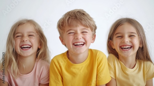 Three joyful kids laughing and express happiness. Perfect for childrens book illustrations, school materials, familythemed marketing campaigns, and childcare promotions. photo