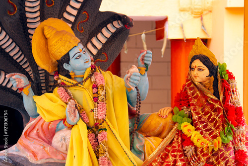 Lord Vishnu and Lakshmi. Hindu sculpture in the temple. Rishikesh. photo