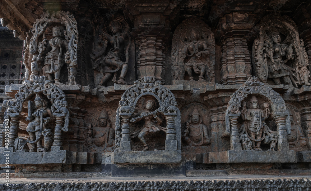 Fototapeta premium Tiny and intricate carvings, sculptures of the temples of the Hoysala Empire. Belur. India.