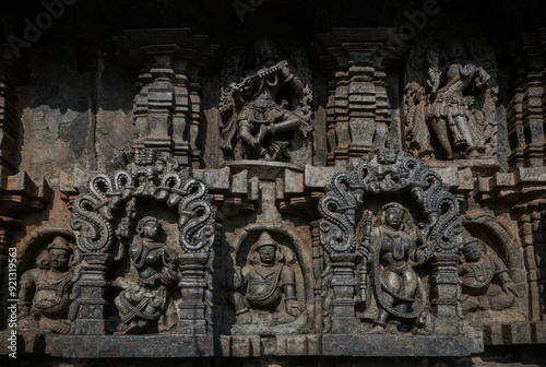Tiny and intricate carvings, sculptures of the temples of the Hoysala Empire. Belur. India.