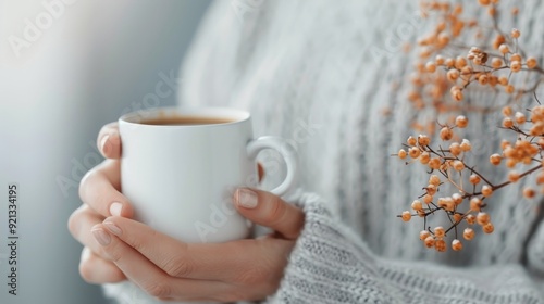 Cozy Hands Holding Warm Cup of Tea in Autumn Afternoon Light