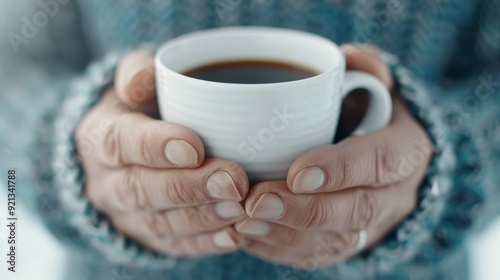 Cozy Hands Holding Warm Cup of Tea in Autumn Afternoon Light