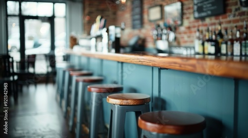 Modern Bar Interior With Wooden Stools and Brick Wall in Afternoon Light