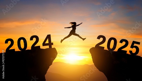 Merry Christmas and Happy new year 2025. A young girl jump between 2024 and 2025 years over the sun and through on the gap of hill silhouette, evening yellow sky. High quality image