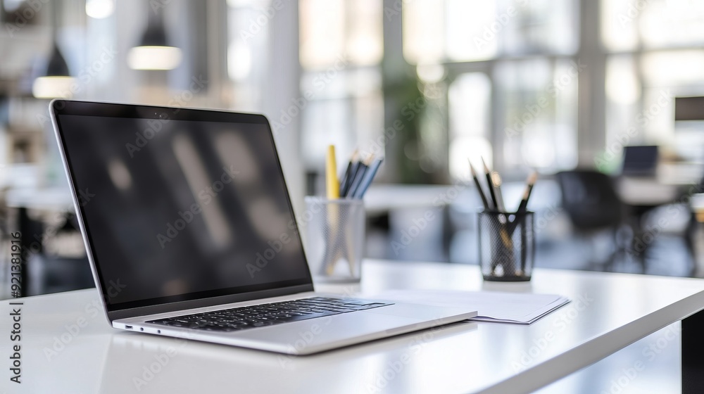 Modern Workspace with Laptop and Stationery Modern Workspace with Laptop and Stationery