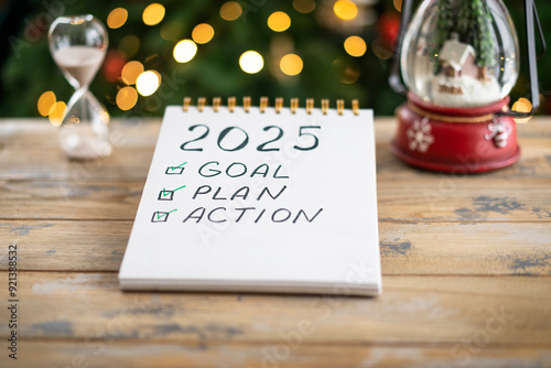 Notepad with plans for the next year and the inscription - 2025 goal, plan, action