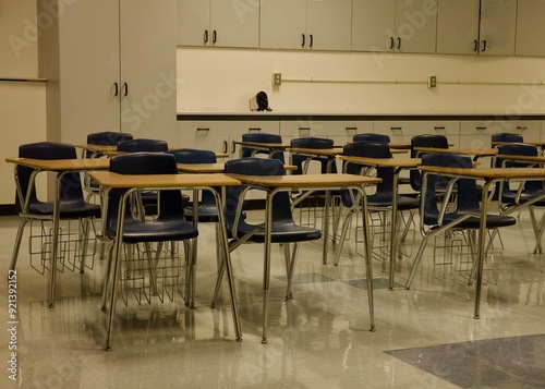 empty classroom with rows of desks