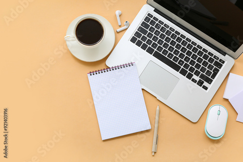 Modern laptop, coffee cup, ...