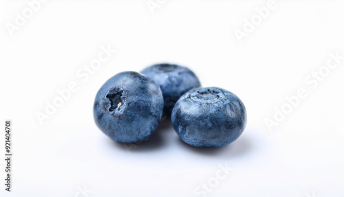 Blueberry Trio: Fresh, plump blueberries, ready to burst with flavor. A trio of blueberries, perfectly ripe and juicy. A simple, clean image that evokes the taste of summer. 