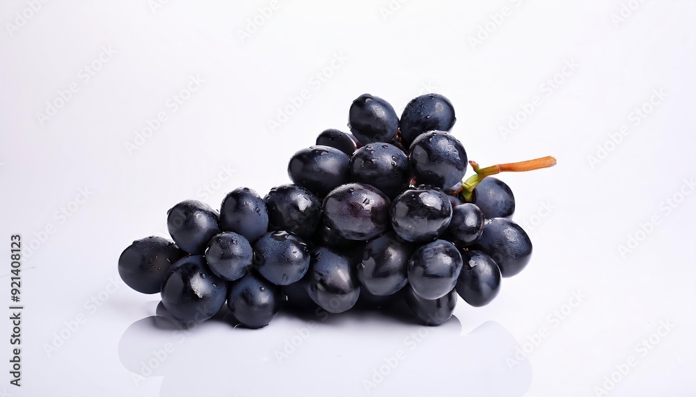 Black Grapes: A cluster of plump, juicy black grapes, glistening with dew, sits on a pristine white background. The vibrant color and natural beauty of the grapes create a visually appealing image pe Black Grapes: A cluster of plump, juicy black grapes, glistening with dew, sits on a pristine white background. The vibrant color and natural beauty of the grapes create a visually appealing image pe
