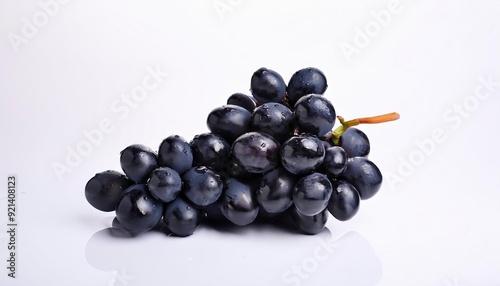 Black Grapes: A cluster of plump, juicy black grapes, glistening with dew, sits on a pristine white background. The vibrant color and natural beauty of the grapes create a visually appealing image pe