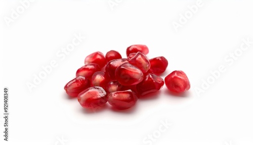 Ruby Red Pomegranate Jewels: A scattering of glistening pomegranate seeds against a pristine white backdrop. 