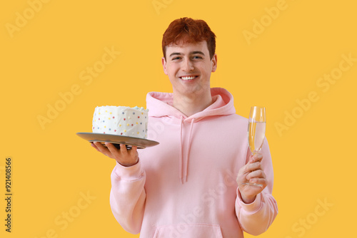 Young man with birthday cak...