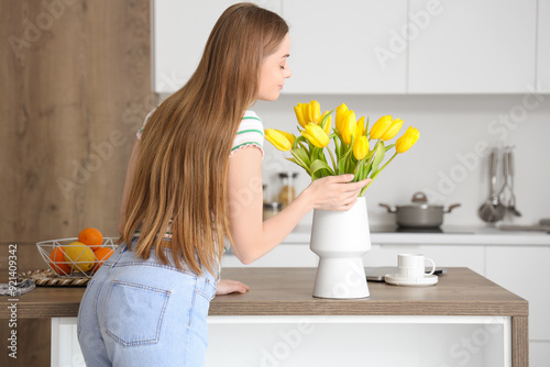 Beautiful young woman smell...