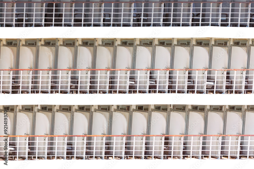 Row of cabins balcony arranged neatly on a ship, showcasing a cruise vacation