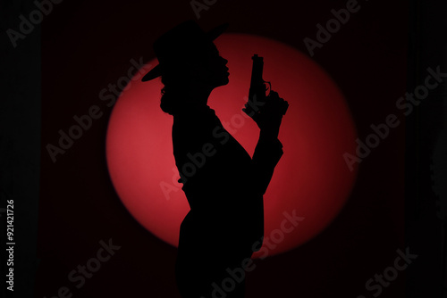 Silhouette of female spy wi...
