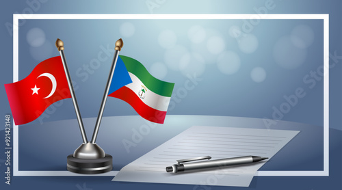 Turkey and Equatorial Guinea Small national flag on bokeh background, cooperative relationship