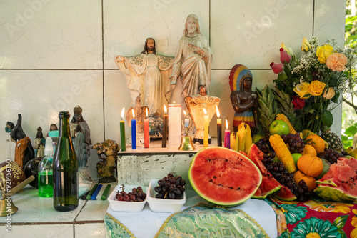 Umbanda altar, a Brazilian religion of African origin, with images, fruits and candles