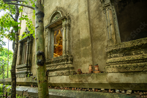 Buddha statue in decadent chapel at Sangkhla Buri Kanchanaburi,Thailand photo