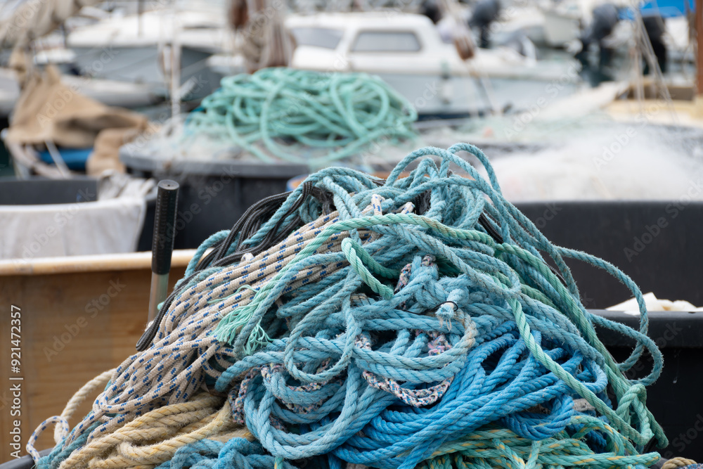 Fisherman's boats, tackles and nets in harbour of coastal town Menton, French Riviera, France, close up Fisherman's boats, tackles and nets in harbour of coastal town Menton, French Riviera, France, close up
