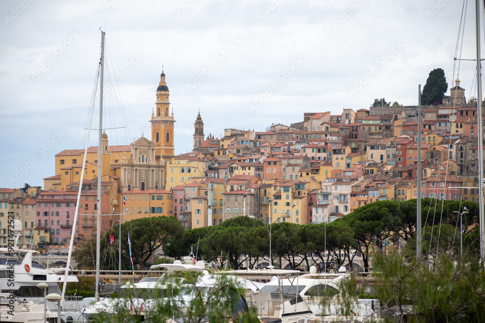 View on French Riviera, colorful Menton old city and marina on blue Mediterranean Sea near French-Italian border, travel destination, panoramic view from above View on French Riviera, colorful Menton old city and marina on blue Mediterranean Sea near French-Italian border, travel destination, panoramic view from above