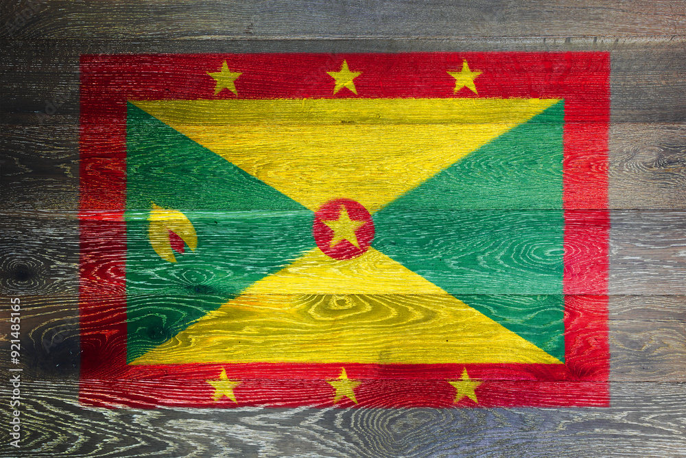 Fototapeta premium Grenada flag on rustic old wood surface background
