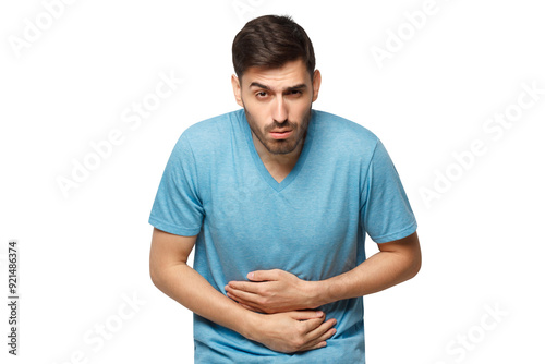 Abdominal pain or ache concept. Young sick man touching his stomach