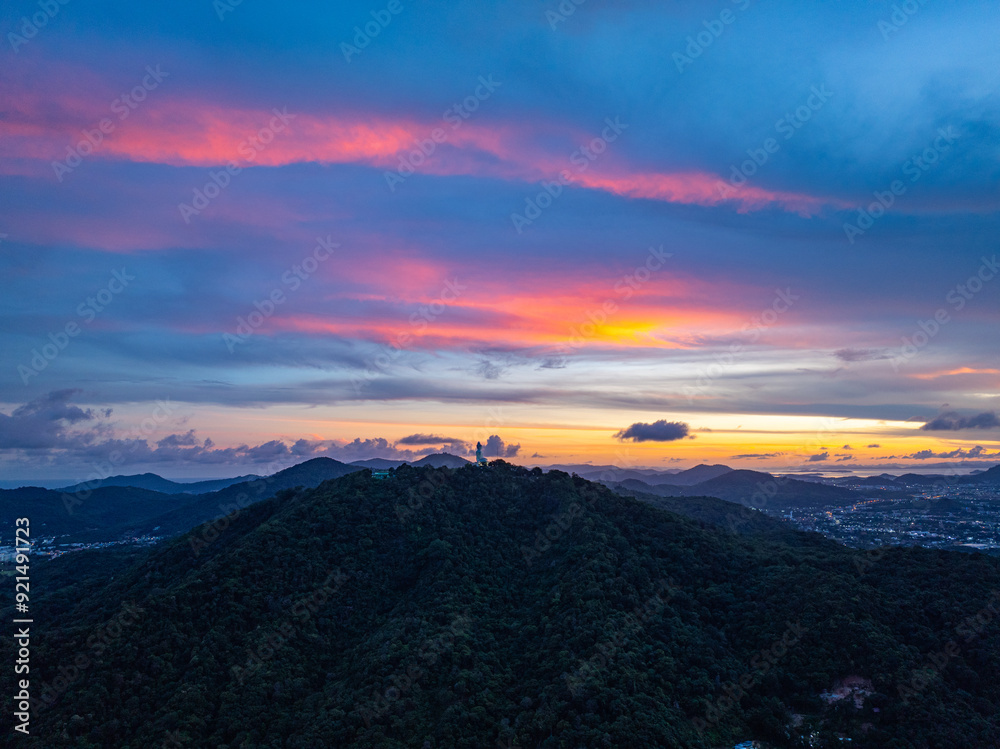 Fototapeta premium aerial night view beautiful lighting around the Phuket big Buddha. .Twinkling lights along the beach and in various towns around Phuket Island. .creative nature and travel concept.lighting 