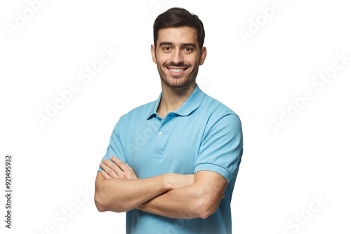 Portrait of young european man standing in blue polo shirt with crossed arms, smiling and  looking at camera