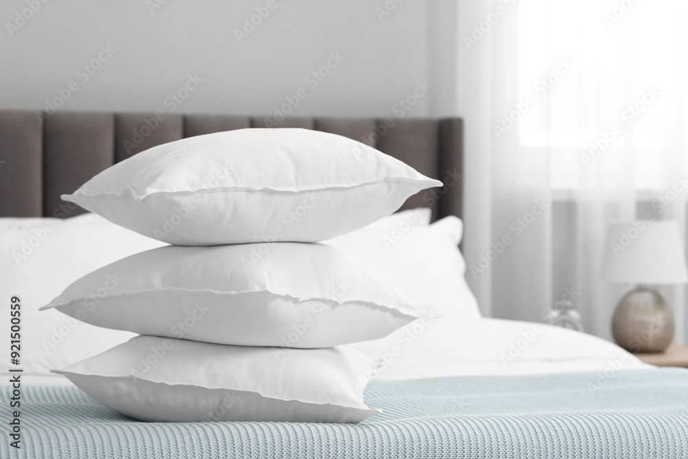 Many soft pillows on bed at home Many soft pillows on bed at home