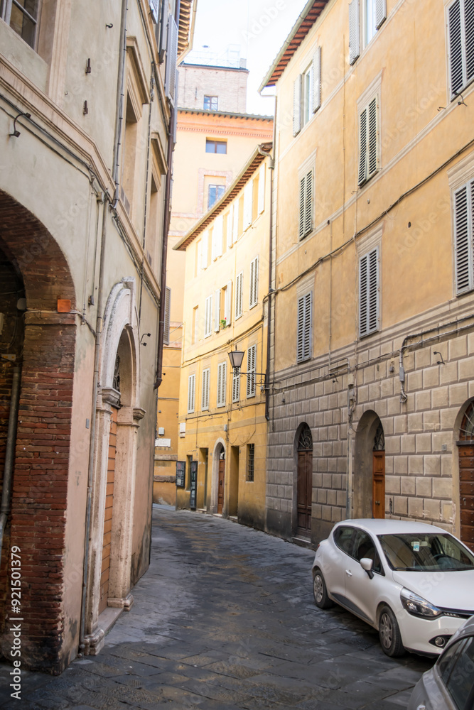 Naklejka premium Narrow street in the Siena old town