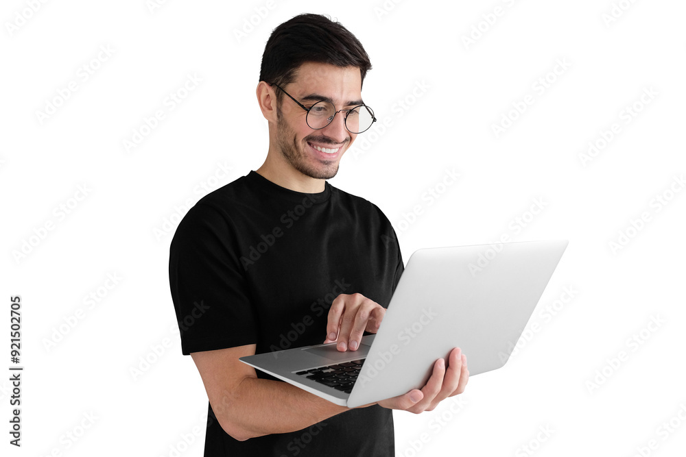Portrait of young man in black t-shirt standing, holding laptop with happy smile Portrait of young man in black t-shirt standing, holding laptop with happy smile