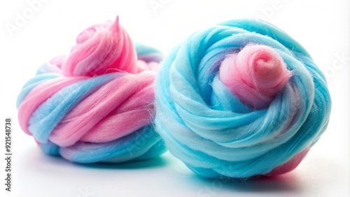 Vibrant pink and blue cotton candy swirls against a white background, highlighting the fluffy, sugary treats in a crisp, isolated composition.