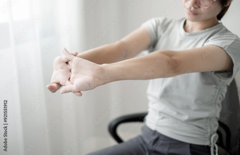 Obraz premium Woman having back pain, shoulder pain pain during work long time. stretching to relax and relax while working hard at the office