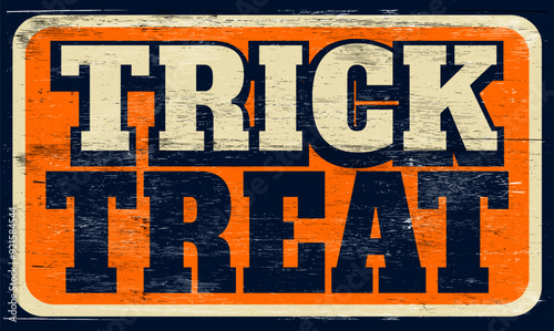 Aged retro trick or treat sign on wood