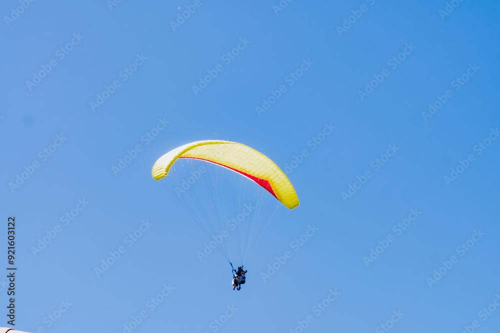 View of the sky. Person flying in a paraglider, leisure activity. Travel and landscapes. View of the sky. Person flying in a paraglider, leisure activity. Travel and landscapes.